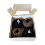 Cupcake kwartet ecru: 2x romper zwart, 2x romper donkergroen, 1 paar zwarte sokken en 1 paar lichtgrijze sokken